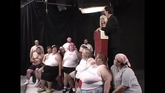 Two dozens of lard-asses suck, lick and fuck each other during The Worlds First 300 Lb Gang Bang, organized by ingenious beauty Kat Kleevage Thumb